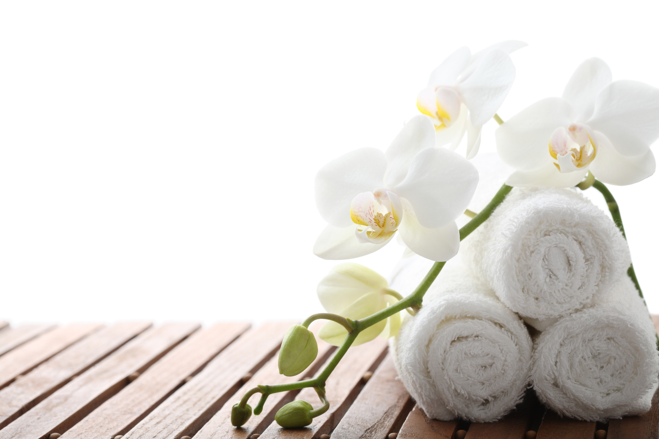 Rolled Face Cloths On A Spa Bench